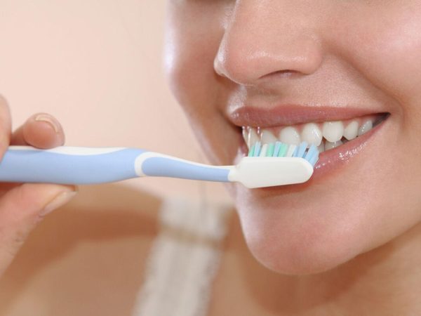 You need to maintain the habit of brushing at least twice a day with a soft-bristle toothbrush to avoid damaging your gums and the crown surface