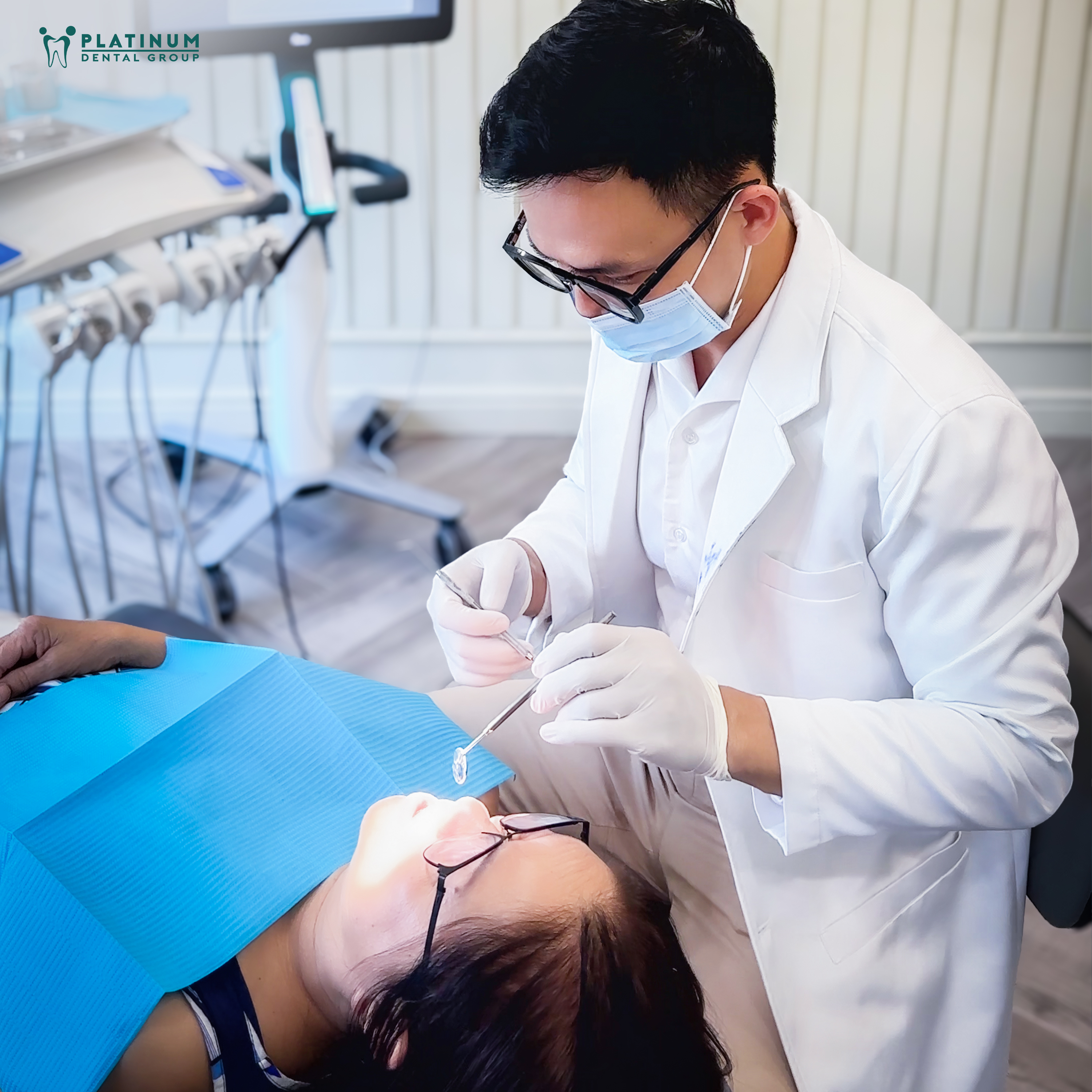 The dentist at Platinum Dental Group is placing an implant for a patient