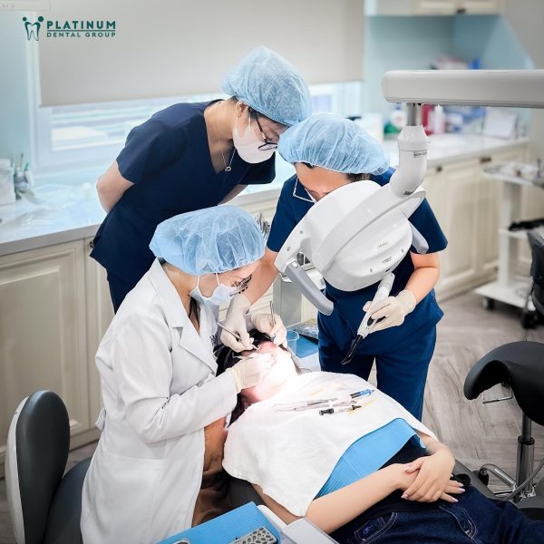 Discover the safe porcelain teeth making process at Platinum Dental Group 10 Dentist is correcting patient's bite and teeth