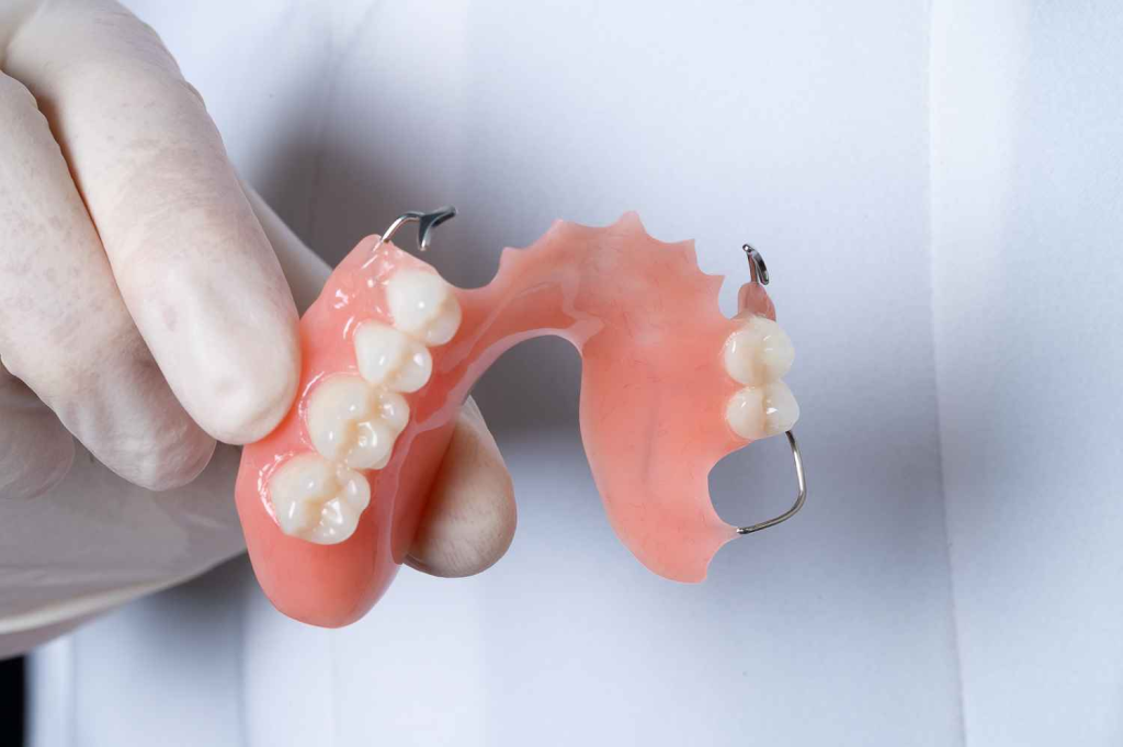 Removable Dentures: Advantages, Types, and Key Considerations 3 An acrylic partial denture, which offers a cost-effective and non-invasive solution for filling gaps in your smile